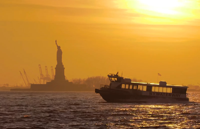 cruise ship statue of liberty sunset