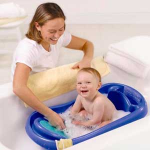 standard plastic baby bathtub with mom washing baby