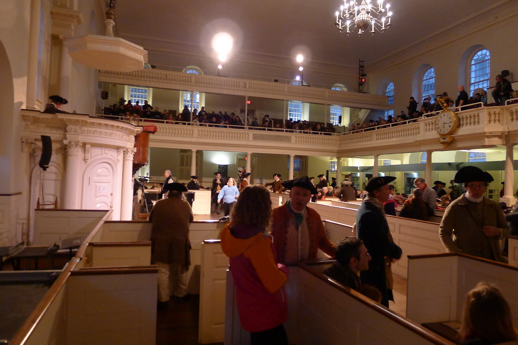 Reenactors and guests gather in Old South Meeting House for the debate over the shipment of tea leading up to the Boston Tea Party